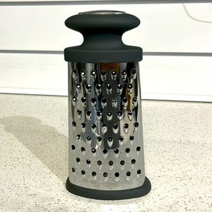 Steel stand up grater. 9.5” tall. By “allthings kitchen”.